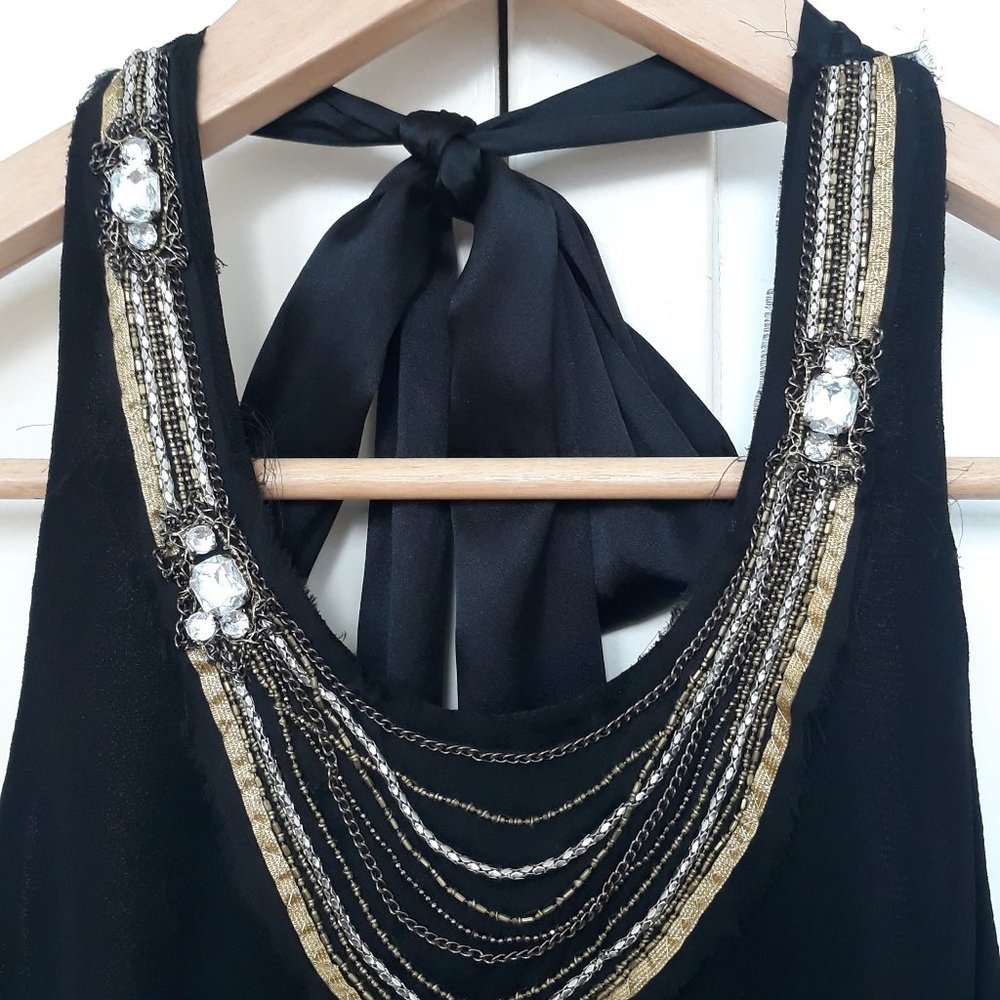 Chic mini dress with jewel necklace and low back